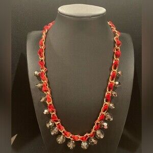 Red felt rope necklace entwined thru gold chain with beautifully faceted beads